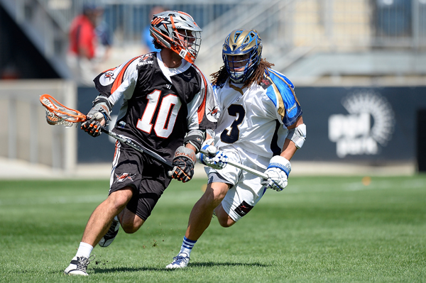 CHESTER, PA - AUGUST 24:  Chris Bocklet #10 of the Denver Outlaws controls the ball against Josh Hawkins #3 of the Charlotte Hounds during the 2013 MLL Semifinal game at PPL Park on August 24, 2013 in Chester, Pennsylvania.  (Photo by Patrick McDermott/Getty Images)